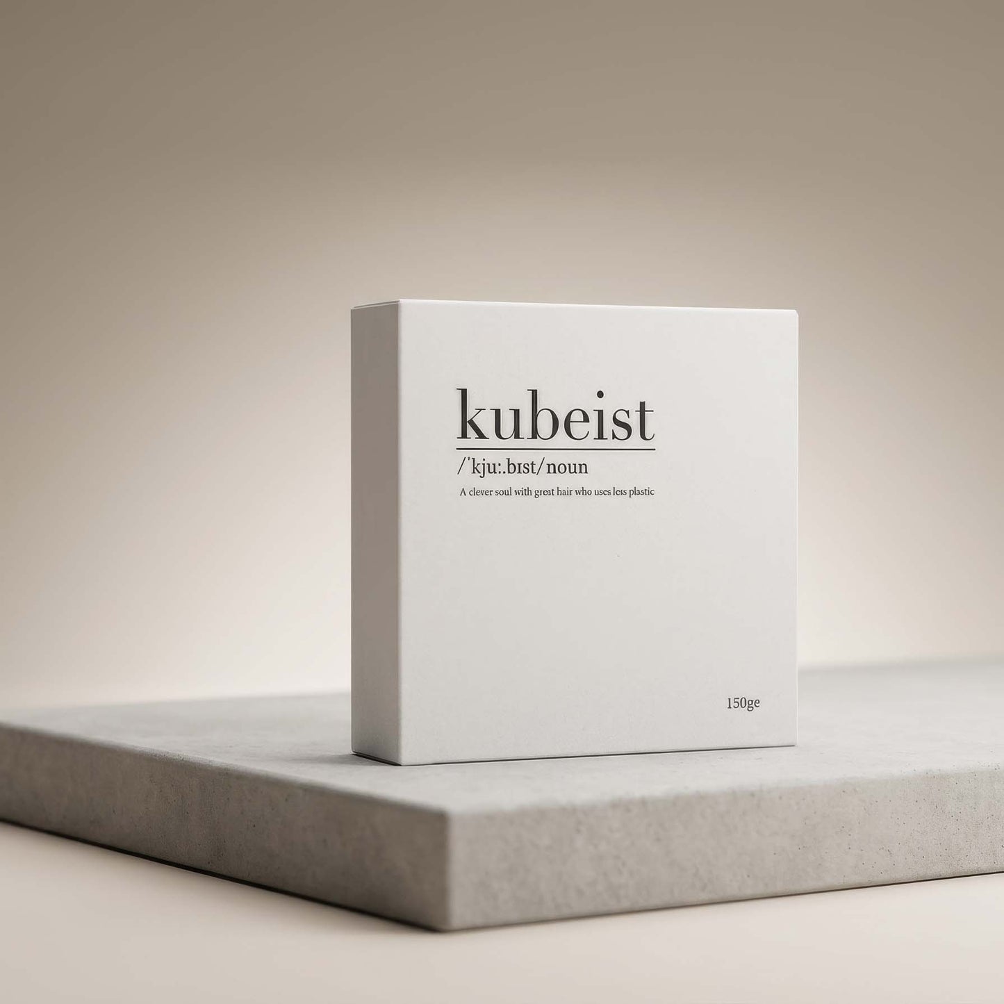 White box with 'kubeist' plastic free shower cubes branding on a gray surface